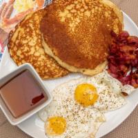 Pancakes · Two eggs and choice of meat: sausage, bacon or ham.