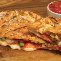 Deluxe Calzone · 1100 cal. Our handmade dough stuffed with pepperoni, Italian sausage, mushrooms, green peppe...