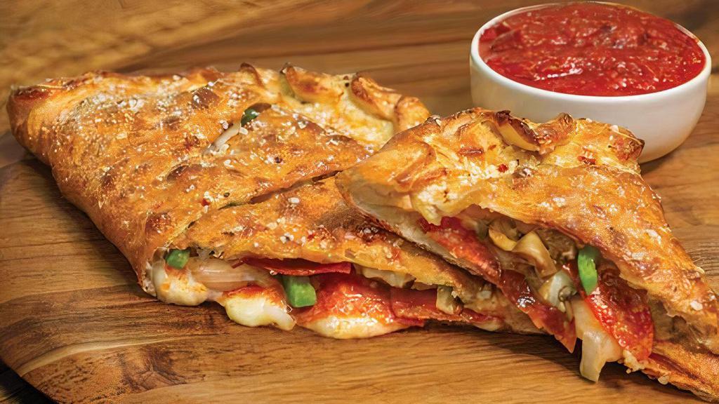 Deluxe Calzone · Stuffed with pepperoni, Italian sausage, mushrooms, green peppers, onions and our signature three cheeses; served with a side of our original pizza sauce