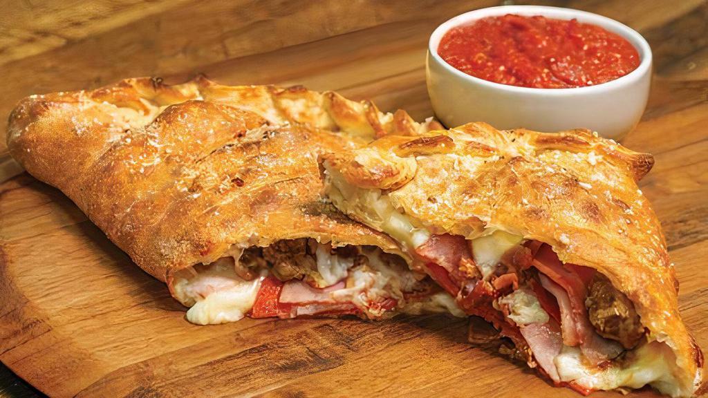 All Meat Calzone · Our handmade dough stuffed with pepperoni, ham, Italian sausage, bacon, and our signature three cheeses; served with a side of our original pizza sauce. 1200 cal.