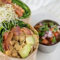 Avocado & Chickpea Wrap · Baby spinach, tomatoes, avocado chickpea salad and lemon avocado dressing on a whole wheat t...