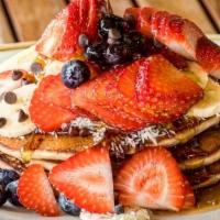 Buckwheat Banan Pancake · Your choice of one free topping: bananas, blueberries, strawberries, chocolate chips or coco...