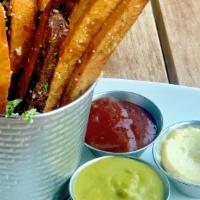 Thick-Cut Fries · Served with three rotating sauces.