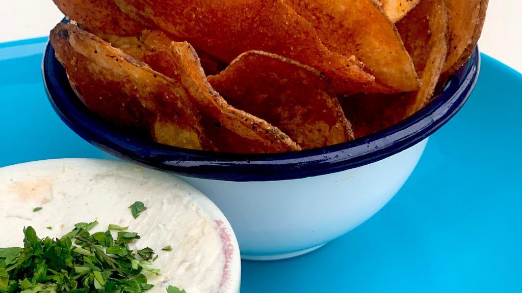 Chips & Dip · Housemade chips and rotating dip.