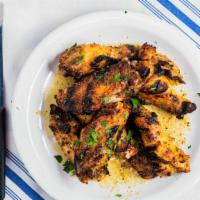 Chicken Wings Ladoregano · Grilled wings with extra virgin olive oil, lemon, and oregano.