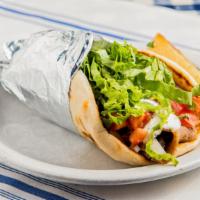 Gyro On A Pita · Gyro slices on a pita with lettuce, tomatoes, onions and tzatziki sauce.
