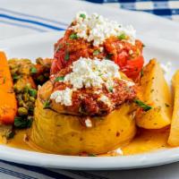 Stuffed Peppers · Fresh peppers stuffed with ground beef, rice, fresh herbs, and sprinkled feta, served with p...