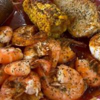 Garlic Shrimp Platter · 12 shrimp, one potato, one corn, one egg, one sausage.