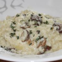 Risotto Ai Funghii · Tossed with three types of mushrooms, truffle oil and parmesan, in cream sauce.