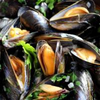 Moules Marinières · Served with garlic, shallots and parsley, in white wine sauce.