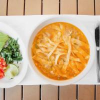 Chicken Tortilla Soup - Bowl · A savory chicken soup loaded with rice, onions, tomatoes and cilantro. Topped with freshly c...