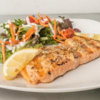 Garlic Herb Salmon · garlic herbs and spices served with lemon and side salad.