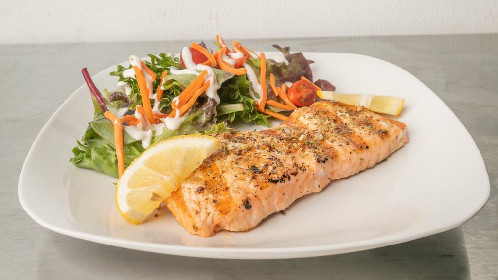 Garlic Herb Salmon · garlic herbs and spices served with lemon and side salad.
