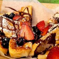 French Toast · Four Slices of Golden Brown Vegan Brioche Bread Served with Fresh Berries and Nutella and Or...