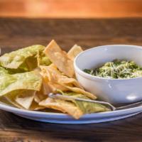 Spinach Artichoke Dip · Homemade, baked, and topped with parmesan cheese. Served with tortilla chips.