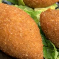 Fried Kibbe · Two pieces. Deep fried seasoned ground beef mixed with crushed wheat and onions, stuffed wit...