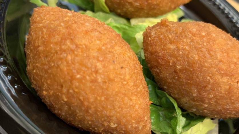 Fried Kibbe · Two pieces. Deep fried seasoned ground beef mixed with crushed wheat and onions, stuffed with ground beef, chopped onions, and spices.