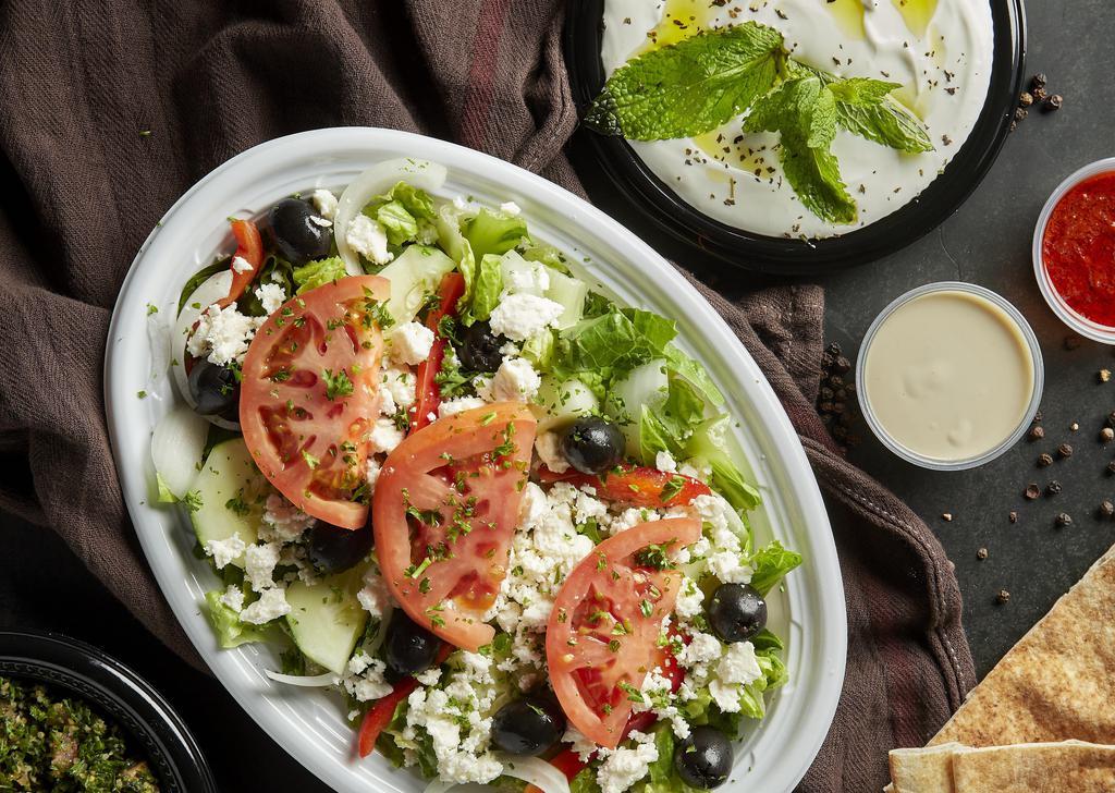 Greek Salad · Lettuce, tomatoes, cucumber, green onions, green pepper, feta cheese, and calamata olives, tossed in our house dressing.