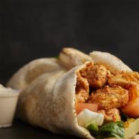 Chicken Shawarma Wrap · Skinless, boneless chicken breast, marinated with herbs and spices. Roasted and served in pi...