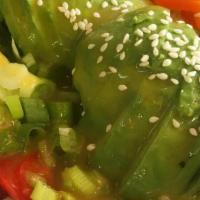 Avocado Salad · The Avocado Salad consists of a bed of lettuce, tomatoes, cucumbers, peppers, and green onio...