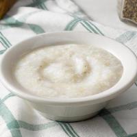 Coarse Ground Grits · Coarse Ground Grits slow cooked with margarine and salt..
