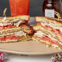 Turkey Club Sandwich · This triple decker features our house roasted turkey with Cruisers house bacon fresh romaine...