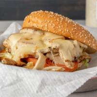 Swiss Turkey Sandwich · House-baked sliced turkey breast grilled up crispy, topped with melted swiss cheese, with le...