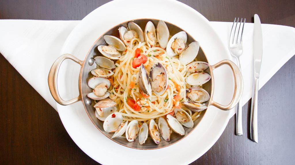 Linguine Alle Vongole Veraci · Baby clams, white wine, garlic, E.V.O.O. tomatoes, red pepper flakes.