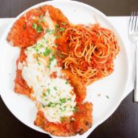 Organic Chicken Parmesan · Serafina signature dish. Pomodoro, mozzarella with spaghetti pomodoro.