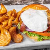 Sixes Farm Burger · Applewood bacon, lettuce, tomato, onion, Cheddar cheese, and mayonnaise topped with a fried ...