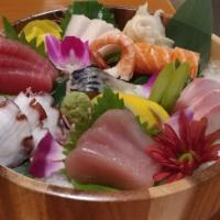 Sashimi Plate · Chef's choice of twelve pieces raw fish slice. Served with soup