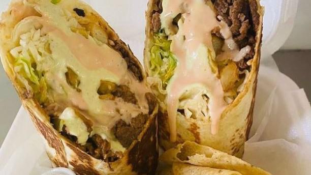 Steak  Burrito · Lettuce, pico de gallo, cheese, pink and garlic sauce.