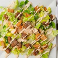 Chicken Caesar Salad · Grilled chicken breast, romaine lettuce, Parmesan cheese, and croutons.