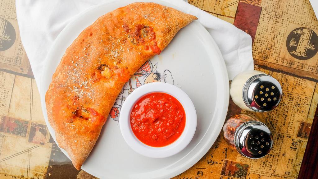 Veggie Stromboli · Mozzarella cheese, onions, black olives, green peppers, mushrooms, and tomatoes.