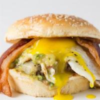5 - Sunny-Side Burger · 100% Grassfed Beef, pasture-raised bacon, pepperjack cheese, sunny-side up egg, salsa verde.