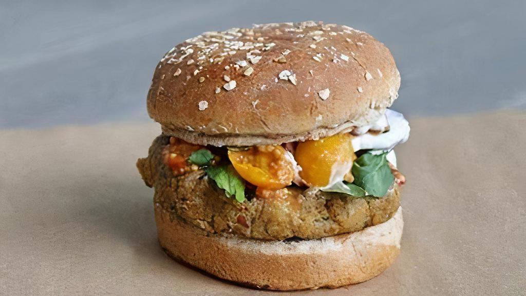 2 - Housemade Vegan Burger · Housemade vegan patty made of quinoa, black eyed peas, kale, roasted mushrooms, and sweet potato. Topped with arugula, tomato chow chow, vegan mayo (chickpea + sunflower oil).