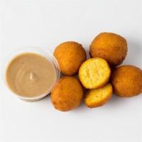 Sweet Potato Hushpuppies · Served with a side of Apple Butter.