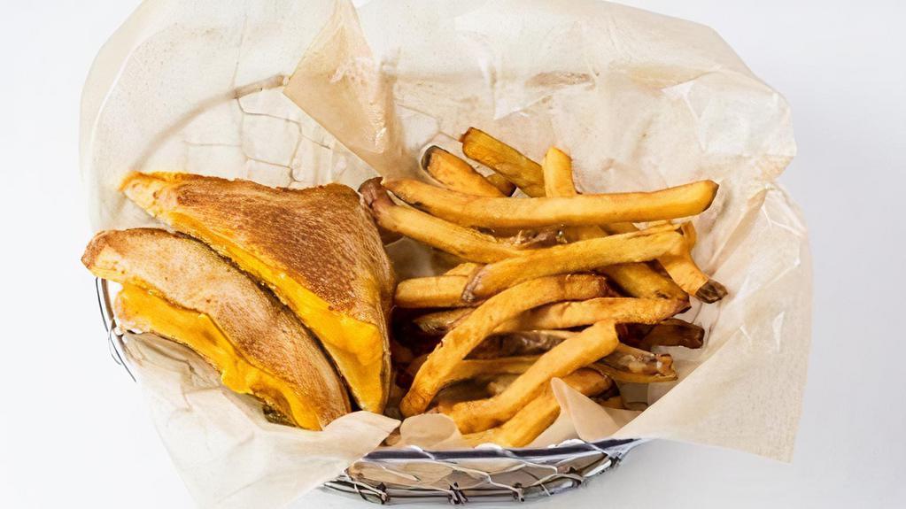 Grilled Cheese Meal · Tillamook yellow cheddar cheese melted on Texas toast. Served with fries OR fruit & veggie cup with sunflower butter dip and a drink.