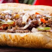 Philly Cheesesteak Dog · 100% Beef hotdog topped with philly steak, provolone cheese, onions and peppers