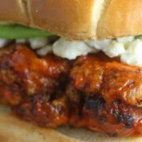 Buffalo Chicken Sandwich · Crispy chicken, covered in buffalo sauce, pickles, lettuce, tomato, chunky blue cheese sauce...
