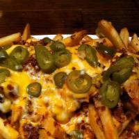 Jalapeno Pepper Fries · Fries topped with cheddar cheese sauce, bacon, ranch, shredded cheese, jalapenos and jalapen...