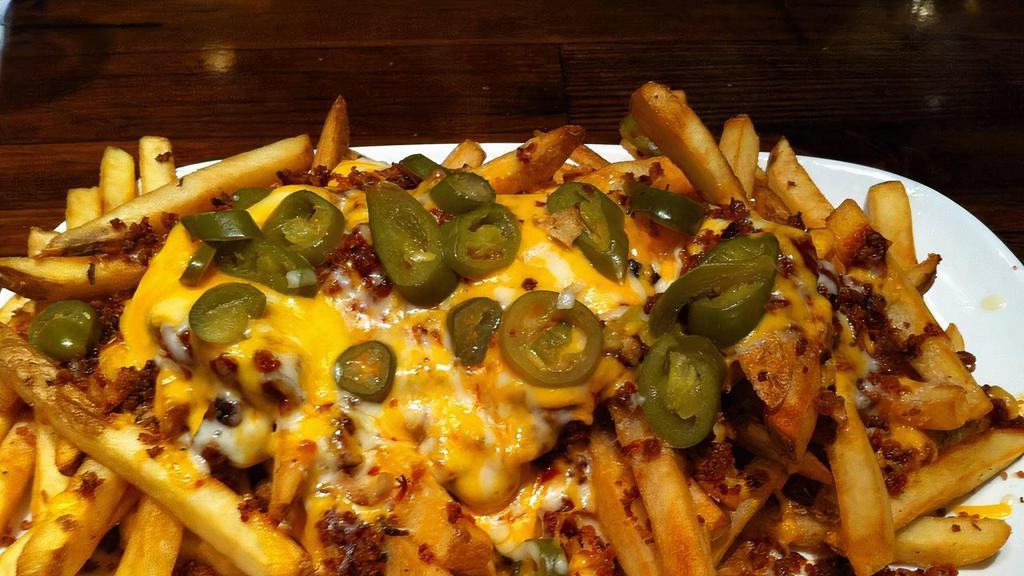 Jalapeno Pepper Fries · Fries topped with cheddar cheese sauce, bacon, ranch, shredded cheese, jalapenos and jalapeno lime seasoning