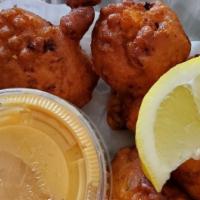 Caribbean Style Conch Fritters · This Bahamian treasure is worth its weight in gold! Tender, juicy conch folded into a
season...