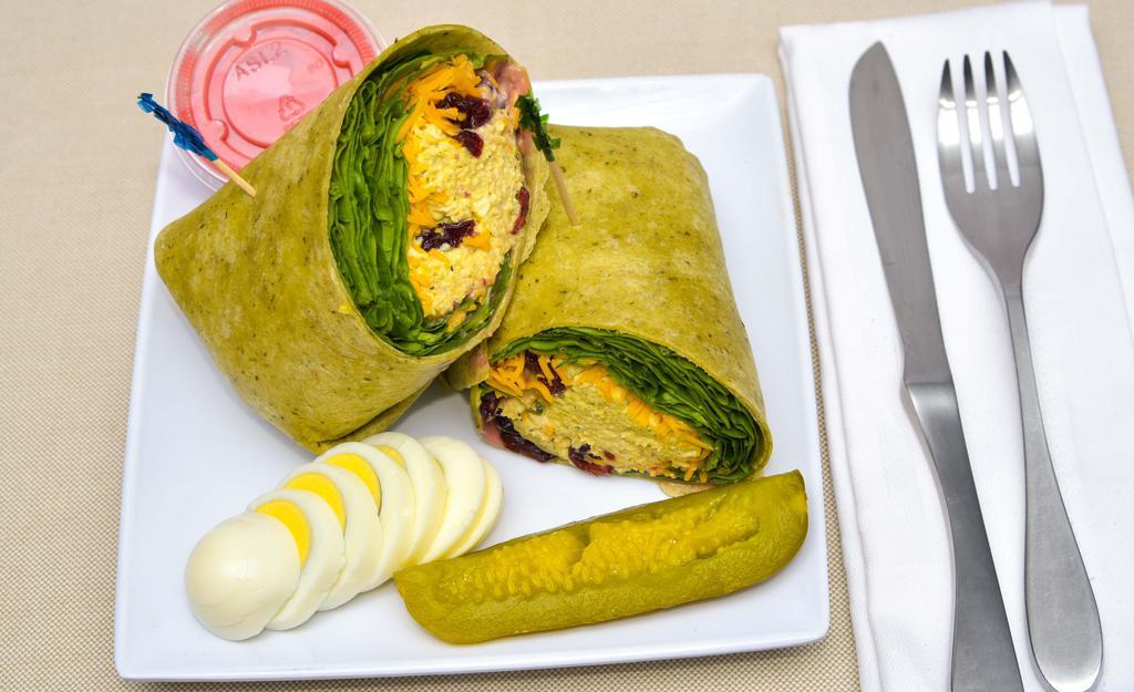 Founders Favorite Wrap · Spicy chicken salad wrap with spinach lettuce, cheddar, cranberries, golden raisins, croutons, and homemade raspberry vinaigrette.