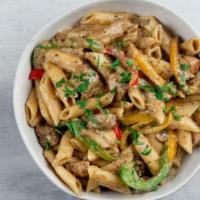 Jerk Chicken Pasta · The heat of the jerk chicken tempered with our creamy white sauce is what makes
Lovely’s Jer...