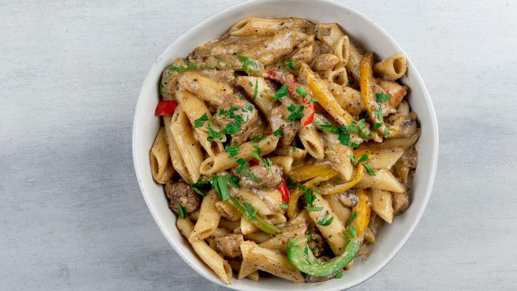 Jerk Chicken Pasta · The heat of the jerk chicken tempered with our creamy white sauce is what makes
Lovely’s Jerk Chicken Pasta one of our favorites. Tender, sliced chicken breast,
mushrooms, fresh peppers and onions folded into a creamy jerk sauce tossed with
tender, al dente Penne pasta. This filling pasta dish is served with lightly toasted
garlic bread.