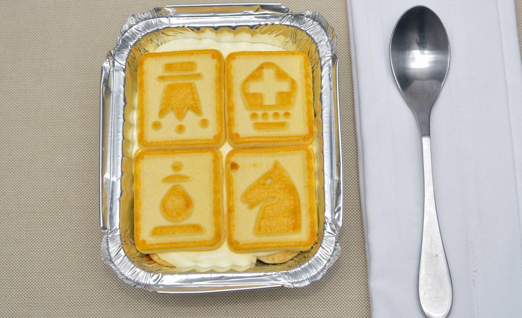 2 Die 4 Banana Pudding · Banana pudding (cold) made in house topped with chessmen butter cookies.