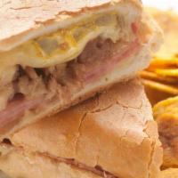 Cubano · Roasted pork, salami, ham, swiss cheese and pickles.