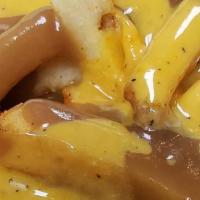 Disco Fries · Golden crisp French fries topped with cheese and brown gravy