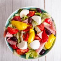 Antipasto Salad · Traditional salad made with salami, ham, mortadella cheese, and fresh vegetables.